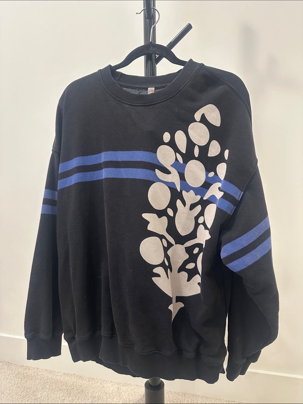 Black Crewneck Sweater with Blue Stripes and White Floral Print